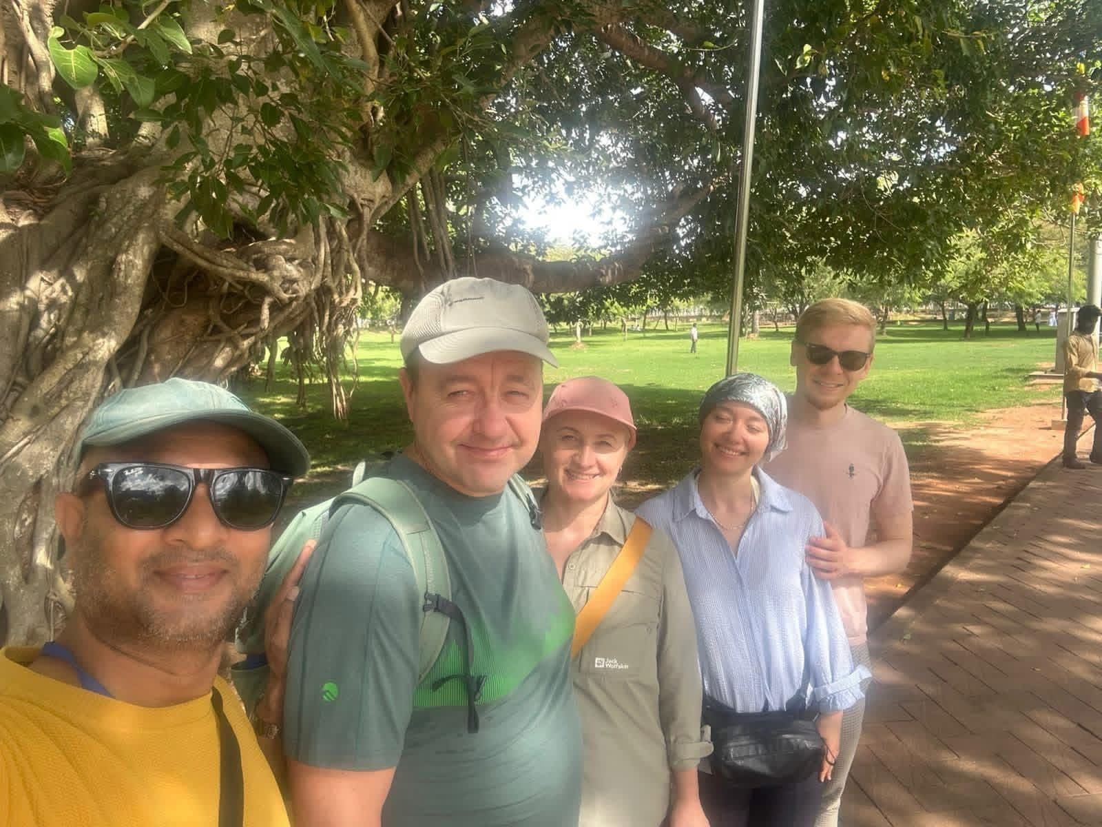 Guests with lotus flowers at Anuradhapura temple